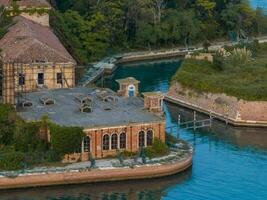 Aerial view of the plagued ghost island of Poveglia in the Venetian lagoon photo