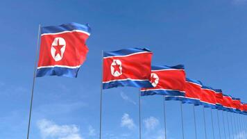 looping video van noorden Korea vlag golvend Aan blauw lucht achtergrond, lus animatie noorden Korea vlag