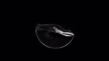 Black water with waves splashing inside the ball with alpha channel video