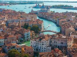 Aerial View of Venice near Saint Mark's Square, Rialto bridge and narrow canals. photo