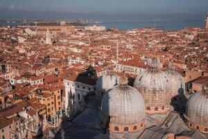 Aerial View of Venice, Italy with Waterways and Buildings in Unknown Color and Style photo