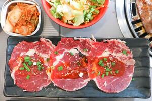 raw beef , sliced beef or beef for cook and Korean salad photo