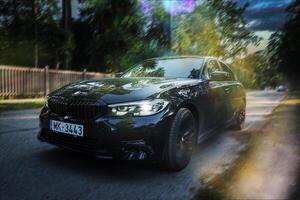 BMW 320 G20 parked on the street of Latvia. photo