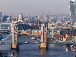 Aerial view of the Iconic Tower Bridge connecting Londong with Southwark photo