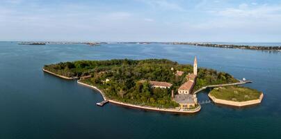 Aerial view of the plagued ghost island of Poveglia in the Venetian lagoon photo