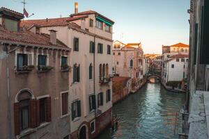 Tranquil Venice canal view with no gondolas or boats, architecture and atmosphere unspecified. photo