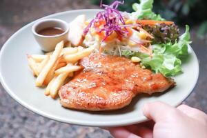 pork steak , grilled pork or sliced pork and salad photo