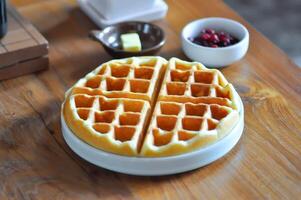 waffle with strawberry dressing and butter photo