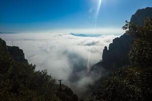 Sunlit Sea of Clouds and Mountain Summits Close to Barcelona, Spain. photo