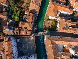 Aerial View of Venice near Saint Mark's Square, Rialto bridge and narrow canals. photo