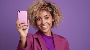 AI generated Curly Blonde Woman Radiates Joy with Peace Gesture, Captures Happiness in Smartphone Selfie. Chic Fashion and Effortless Elegance Against a Purple Backdrop. Celebrating Life's Enjoyable photo