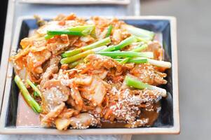 stir fried pork with chinese cabbage and kim chi photo