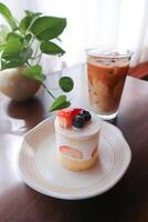 strawberry shortcake or strawberry cake with strawberry and blueberry topping and coffee photo