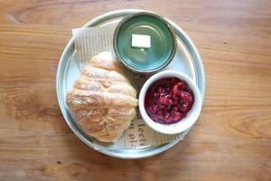 croissant ,French croissant or chocolate croissant or French bread with butter and blueberry dressing photo