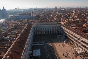 Venice cityscape with Gothic, Renaissance, and Baroque architecture, red-tiled roofs, and picturesque canals photo