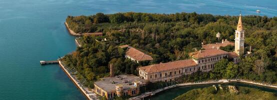 Aerial view of the plagued ghost island of Poveglia in the Venetian lagoon photo