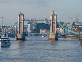 Aerial view of the Iconic Tower Bridge connecting Londong with Southwark photo