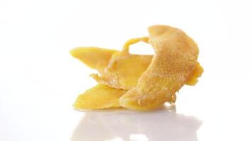 slices of sweet ripe dried mango isolated on white background video