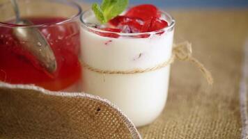 homemade sweet yogurt with fruit jelly pieces in a glass video