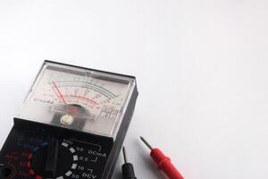 Multimeters are used to test electrical circuits, batteries, and other devices.  close up multimeter isolated on white background. photo