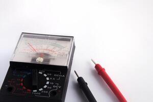 Multimeters are used to test electrical circuits, batteries, and other devices.  close up multimeter isolated on white background. photo