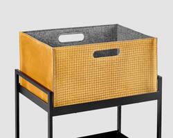 Comfortable tan suede woven storage box on metal shelving rack photo