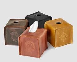 Leather tissue box covers with embossed designs on white photo