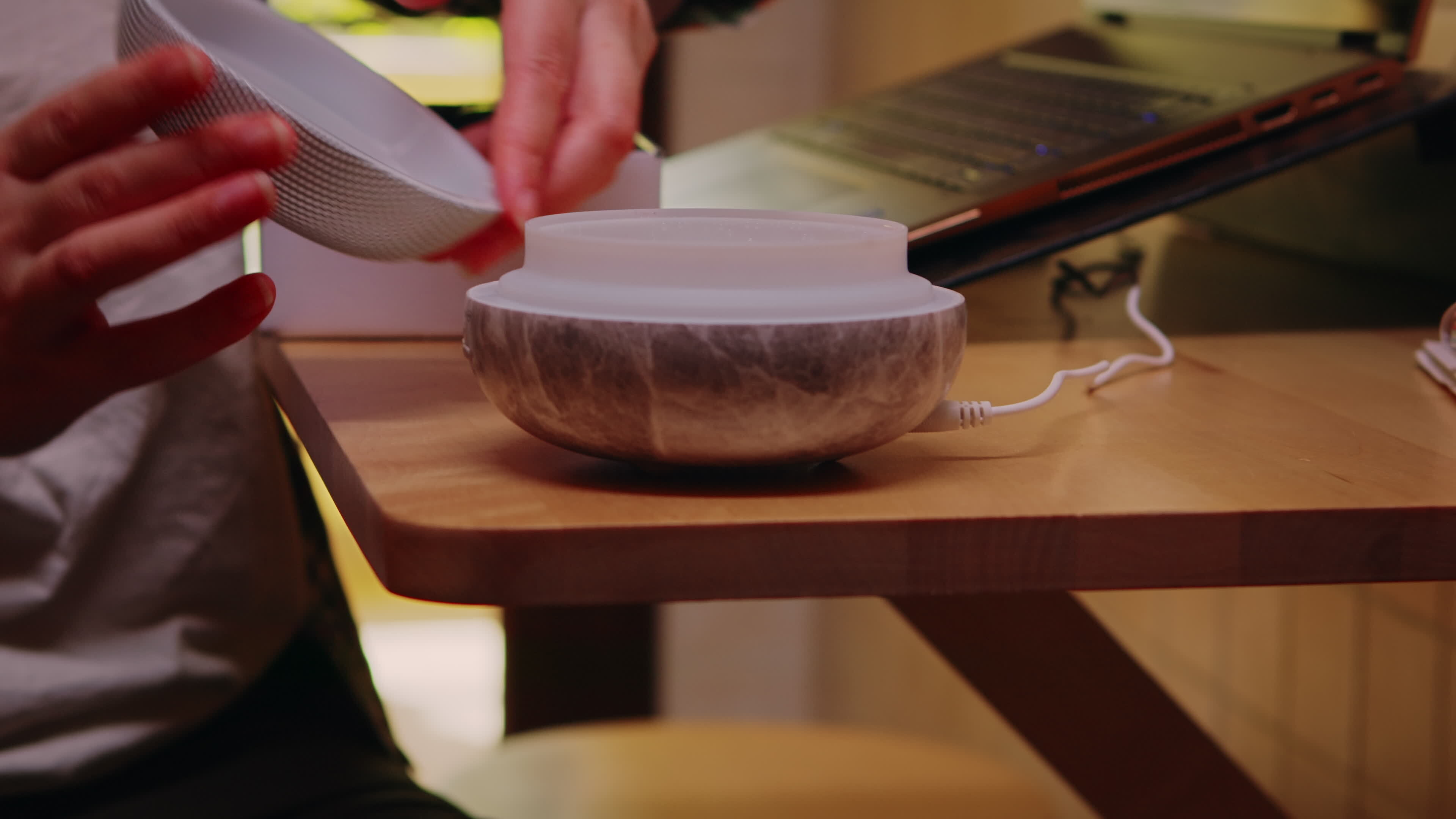 Female freelancer in kitchen turning on essential oil diffuser. 38909446 Stock Video at Vecteezy