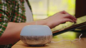 Steam from humidifier with aromatic perfume while woman is working on laptop. video