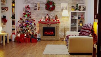 A beautiful living room decorated for christmas celebration, Fireplace and candles burning. video