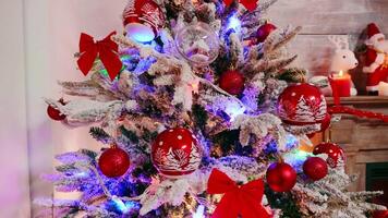 Close up of christmas tree with garland in living room. Winter holiday. video