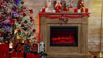Beautiful christmas tree and fairy lights decoration for winter holiday. Fireplace burning. video