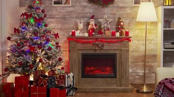 Cozy living room decorated for christmas celebration. Fireplace burning. video