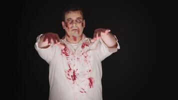 Caucasian young man dressed up like zombie for halloween. video