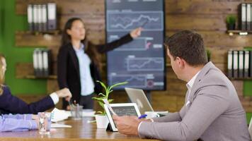 Businessman working in the conference room holding chars. Coworker presenting strategy in the conference room. video