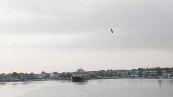 Big cruise ship anchored on harbor docks ready to leave with tourists. video