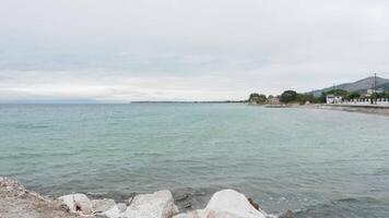 Calm sea waves smashing into rock seashore. End of summer holiday. video