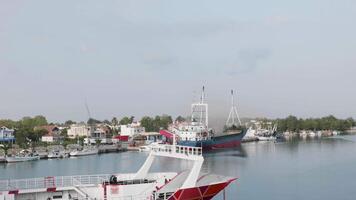 Big ship in port loaded with sand from harbor. Marina bay. video