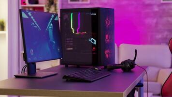 Powerful personal computer in gamers room full of neon colors. video