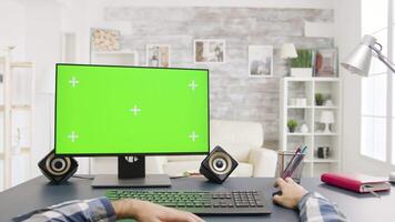 POV shot of male hands working on display with green screen. In the backgorund - modern and bright flat with big windows video