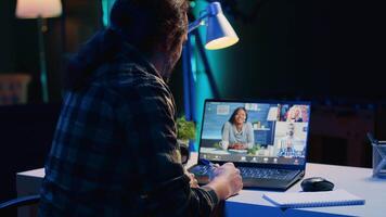 Remote worker talks with board of directors during videocall business meeting from home office. Teleworker speaks in remote videoconference telework call, receiving feedback from management, camera A video