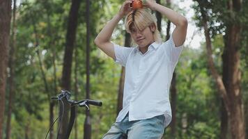 Handsome happy young man with bicycle on a city street, Active lifestyle, people concept video