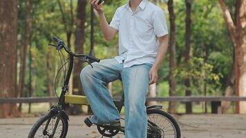 Handsome happy young man with bicycle on a city street, Active lifestyle, people concept video