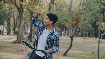 Handsome hipster enjoying city ride by bicycle. video