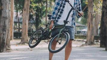 Handsome hipster enjoying city ride by bicycle. video