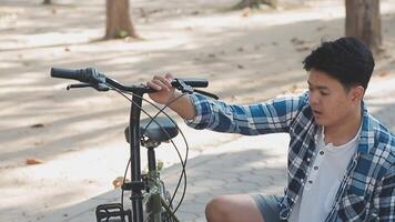 Handsome hipster enjoying city ride by bicycle. video