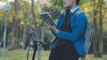 The red bearded man in casual clothes is cycling on the road in the morning city. Healthy lifestyle concept video