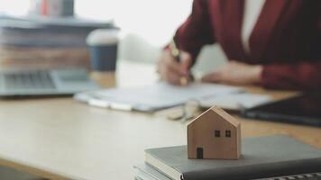 Person Hand Doing Property Tax Calculation Using Calculator Of House Model video