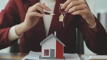 Person Hand Doing Property Tax Calculation Using Calculator Of House Model video