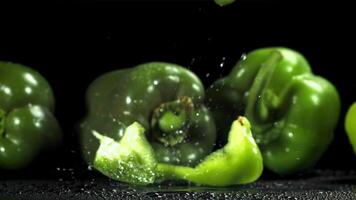 Sliced bell peppers fall on the table. Filmed on a high-speed camera at 1000 fps. High quality FullHD footage video